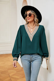 Green blouson top with embroidered V-neck trim and cuffs, long sleeves