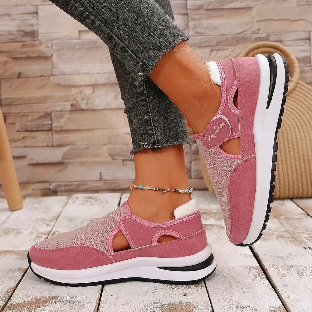 Pink mesh platform slip-on sneakers with cutout details and a white "Fashion" accent.