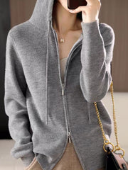 Gray ribbed knit zip-through hoodie with drawstring hood and silver zipper.