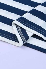 Navy and white striped jersey maxi dress detail showing hem stitching.
