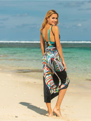 Multicolor pareo wrap with black panels and a bold abstract print, styled with a bikini top.