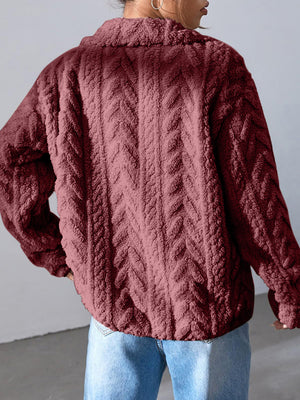 Burgundy textured chevron fleece zip jacket with a collared neckline.