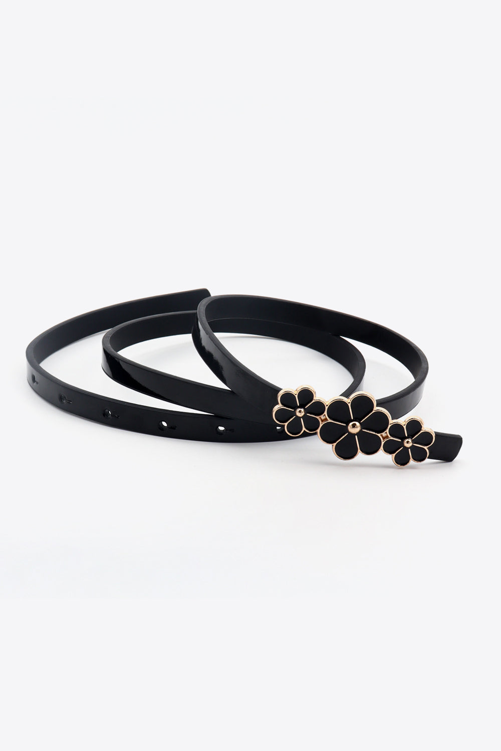 Black skinny belt with floral blossom buckle detail