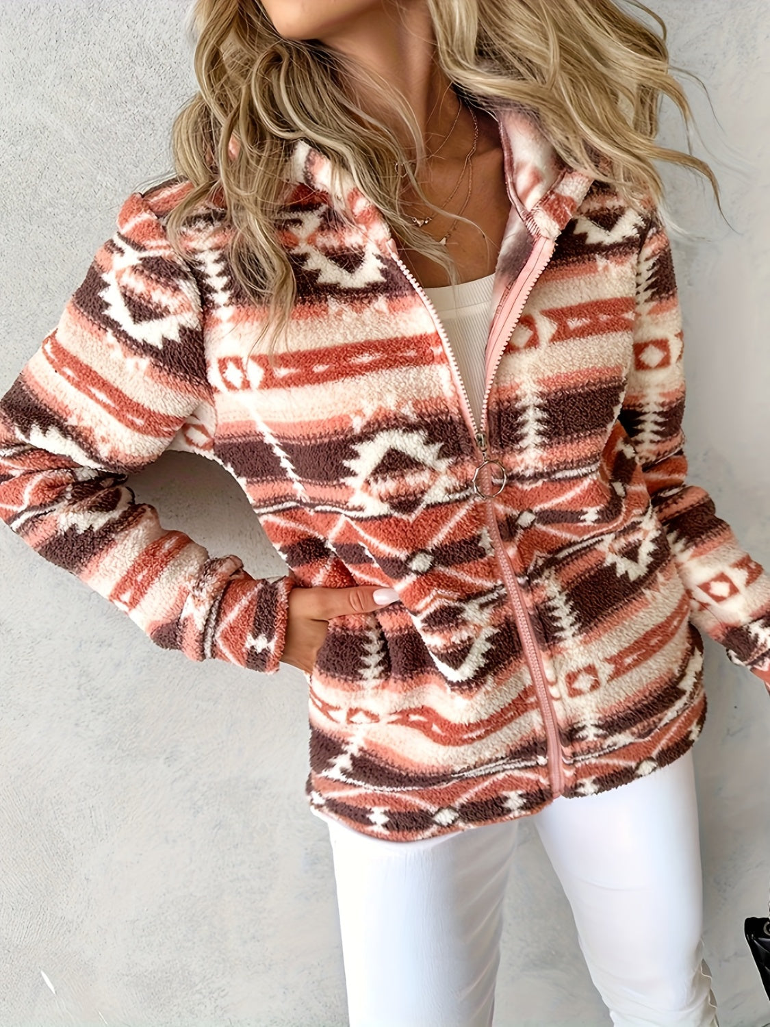 Brown Aztec-inspired sherpa zip hoodie with a fuzzy texture and geometric pattern.