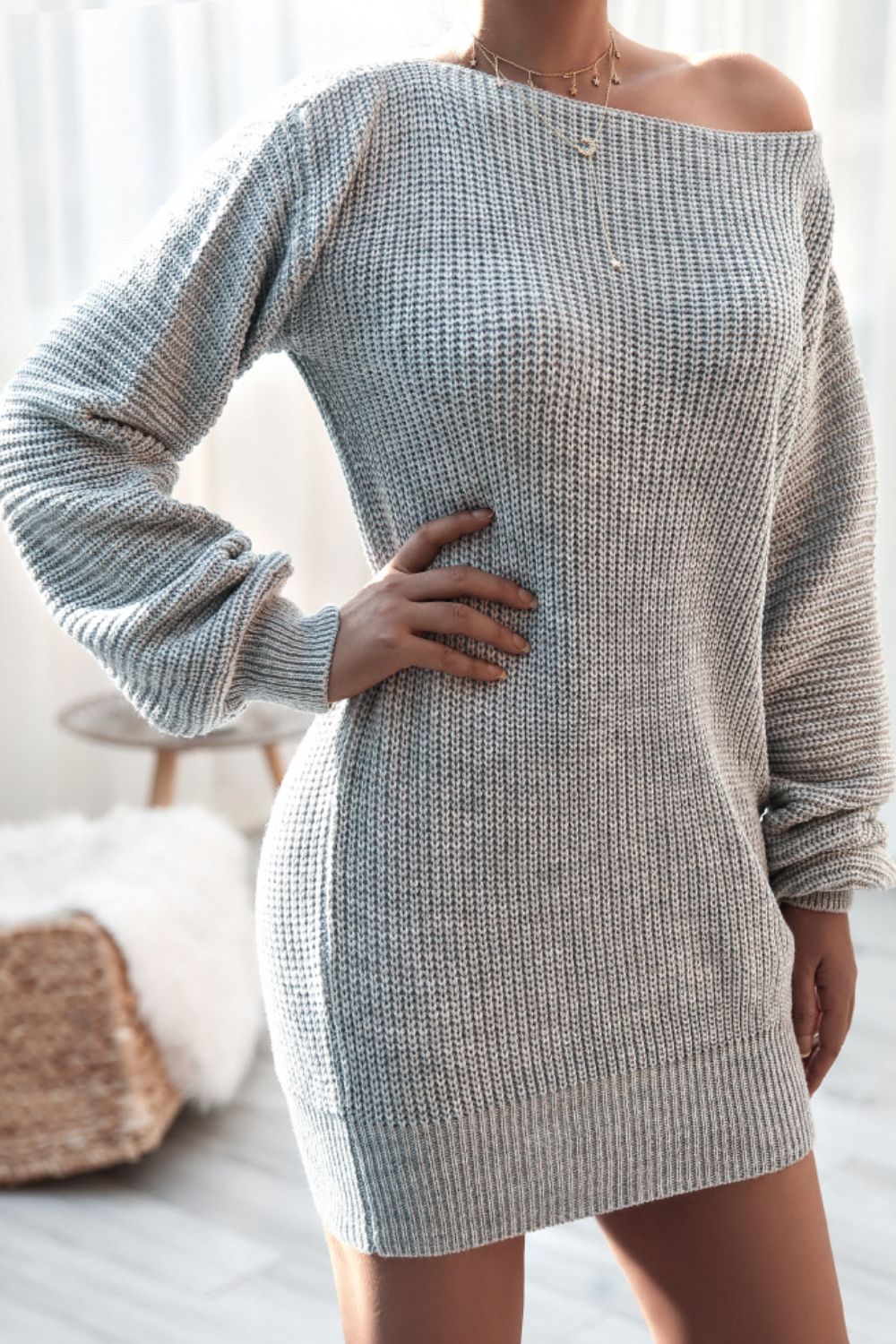 Gray ribbed knit off-the-shoulder mini dress with long sleeves and a boat neckline.
