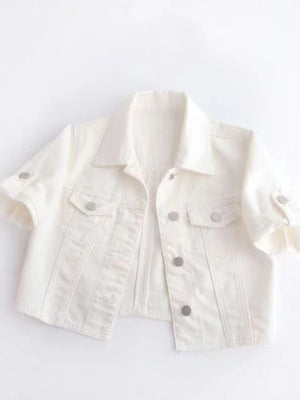 White denim cropped jacket with rolled sleeves and silver buttons