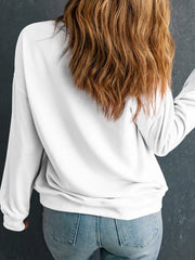 White crewneck sweatshirt with graphic detail on back, long sleeves, casual fit.