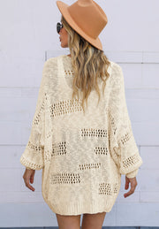 Beige open-knit slouch cardigan with airy, mixed stitch pattern and balloon sleeves.