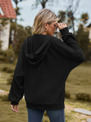 Black textured knit dolman sleeve hoodie with a relaxed fit and hood.