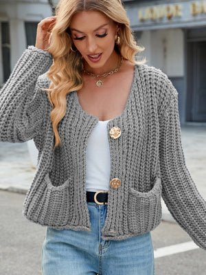 Gray chunky knit cardigan with gold buttons and pockets