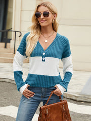 Ribbed Henley colorblock knit sweater with v-neck and button detail in teal, white, and blue.