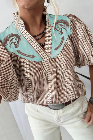 Brown gingham puff sleeve shirt with embroidered horse yoke and contrast trim.