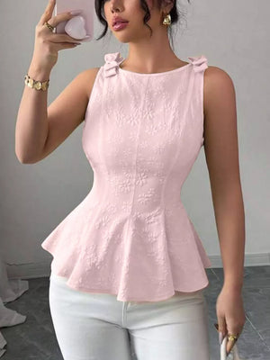 Pink peplum tank top with floral embroidery and bow shoulder details