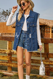 Dark denim sleeveless jacket with distressed details and frayed hem.
