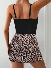 One-piece swimsuit with leopard print skirt and adjustable straps.