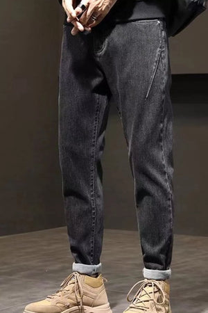 Relaxed fit plus size straight leg jeans in black denim with cuffed hems.