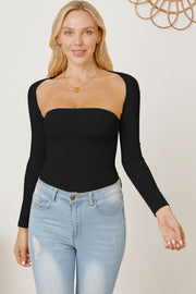 Black long sleeve bodysuit with square neckline and open back detail, styled with jeans.
