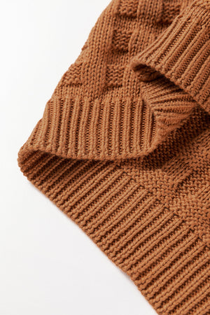 Textured knit boxy top in camel acrylic with ribbed details and a woven pattern.