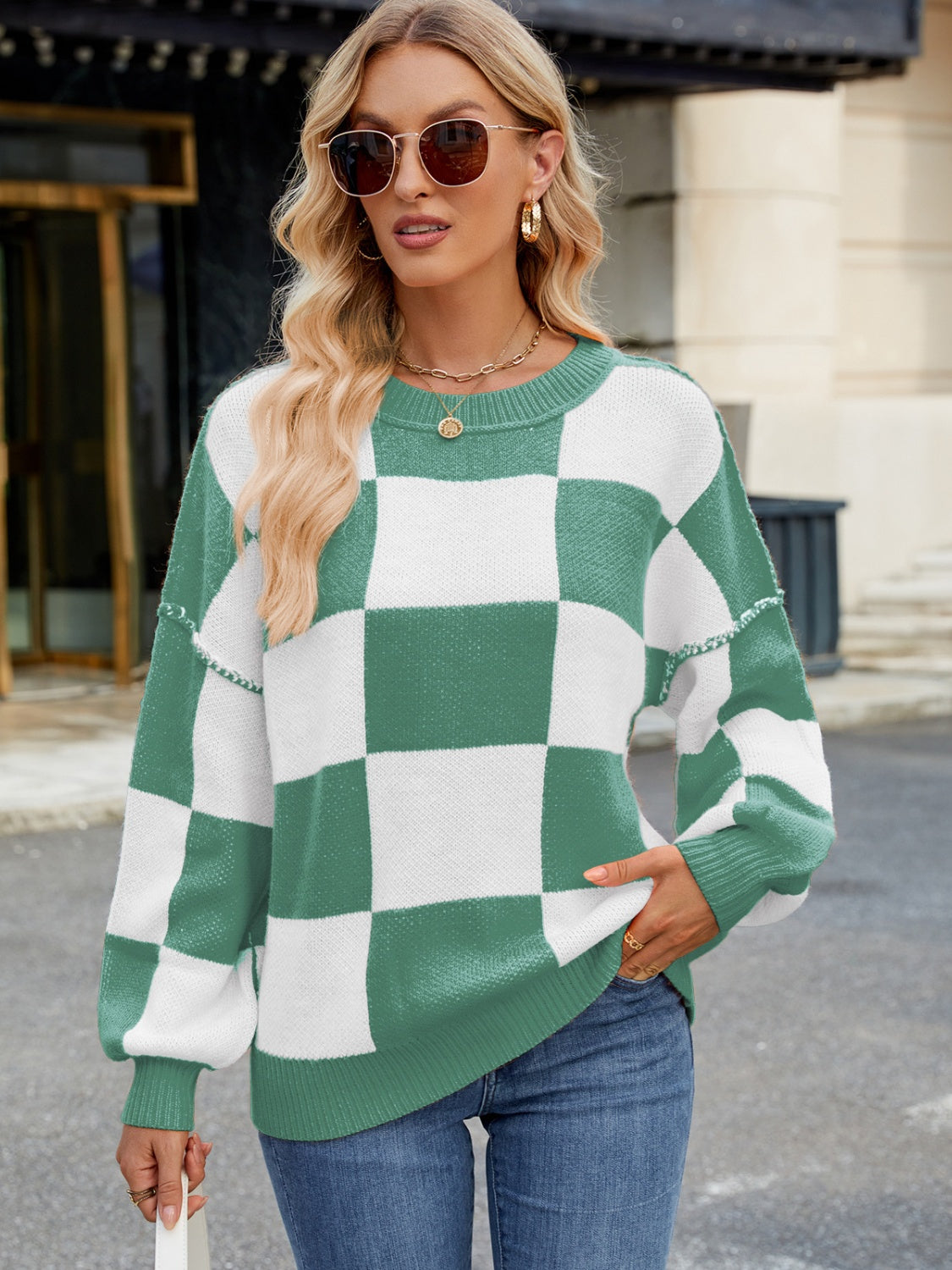 Checkerboard knit sweater in Gum Leaf green and white with balloon sleeves and crew neck.