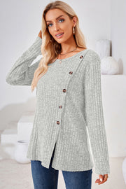 Light Gray ribbed knit top with asymmetric button detail and long sleeves.