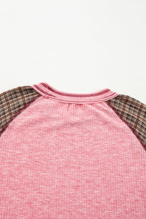 Pink raglan tee with plaid sleeves and a ribbed texture.