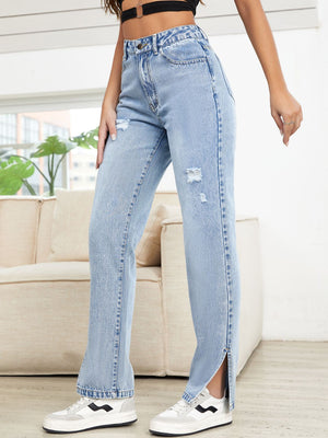Light wash denim straight leg jeans with distressed details and slit hems.