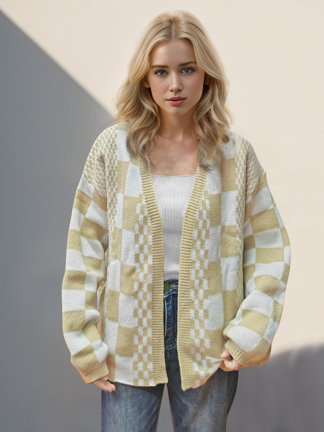 Checkerboard knit open-front cardigan in tan with a relaxed fit and long sleeves.