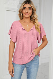 Pink eyelet tie-neck blouse with flutter sleeves and V-neck