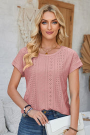 Perforated eyelet tee in blush pink with cuffed short sleeves and a round neckline.
