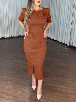Brown bodycon midi dress with 3D floral detail, ruched waist, and puff sleeves.