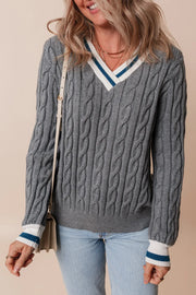 Cable knit sweater in dark gray with v-neck and varsity stripe trim on neckline and cuffs.