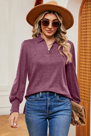 Buttoned Paradise Lantern Blouse in dark purple with buttoned cuffs and a collared neckline.