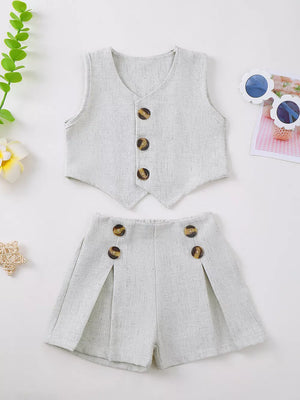 Baby vest and shorts set in light grey textured fabric with decorative buttons.