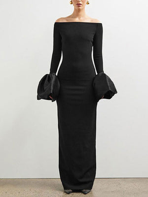 Black off-shoulder maxi dress with dramatic bell sleeves and a bodycon fit.