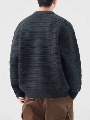 Men's dark gray ribbed knit cardigan with button-down front and collar.