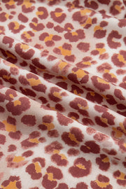 Leopard print dress fabric with ruffled detail and v-neck detail