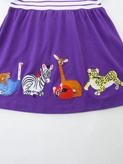Purple cotton blend toddler dress with embroidered animals and striped yoke.
