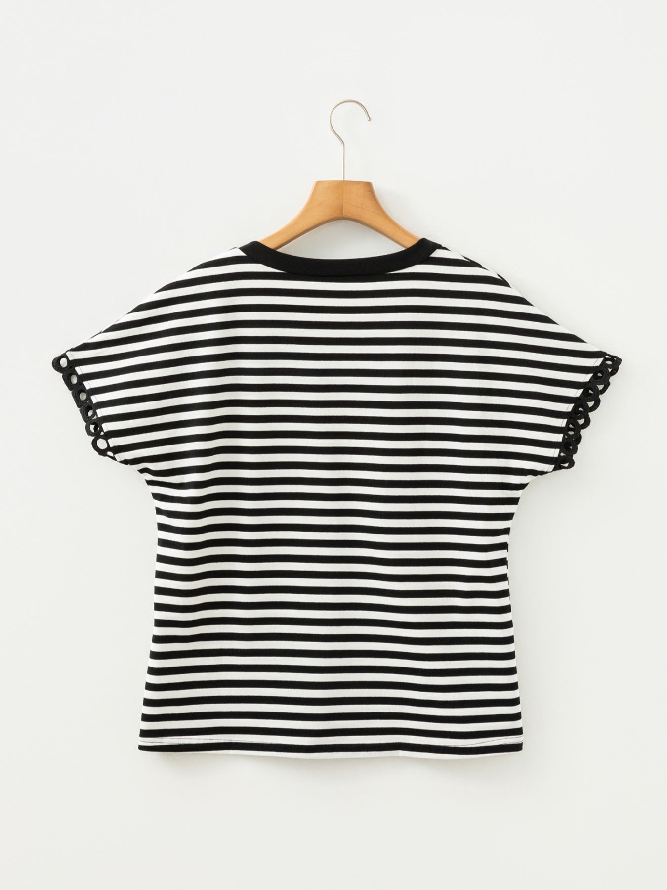 Black and white striped cotton t-shirt with black trim and scalloped sleeve detail.