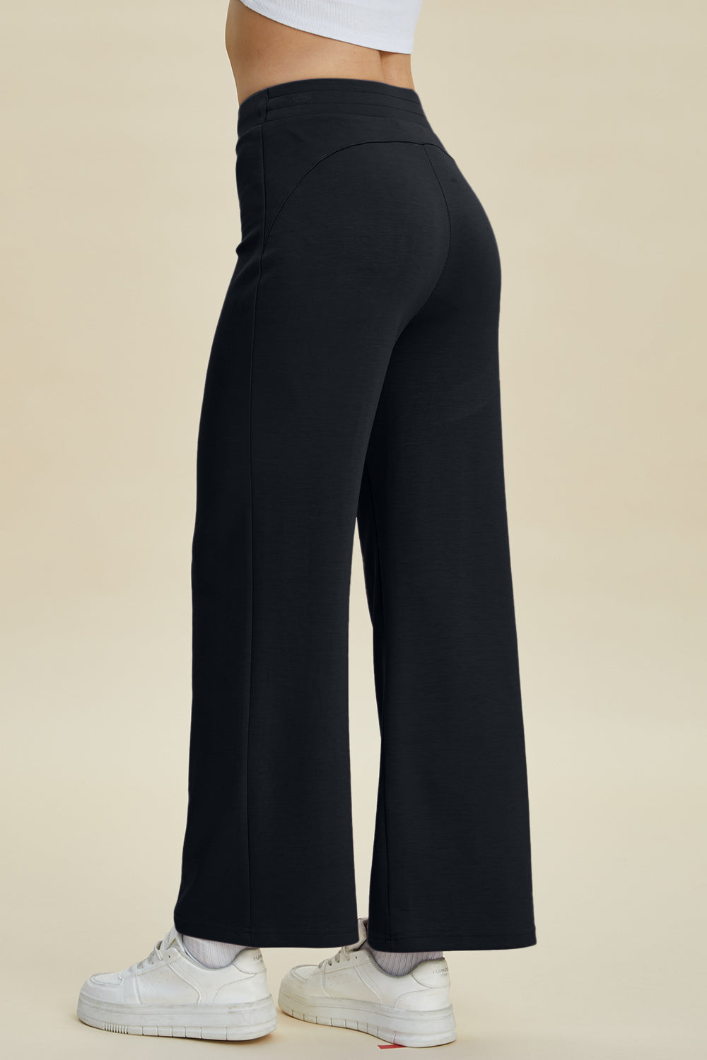 Black wide leg lounge pants with a soft drape and high waist.