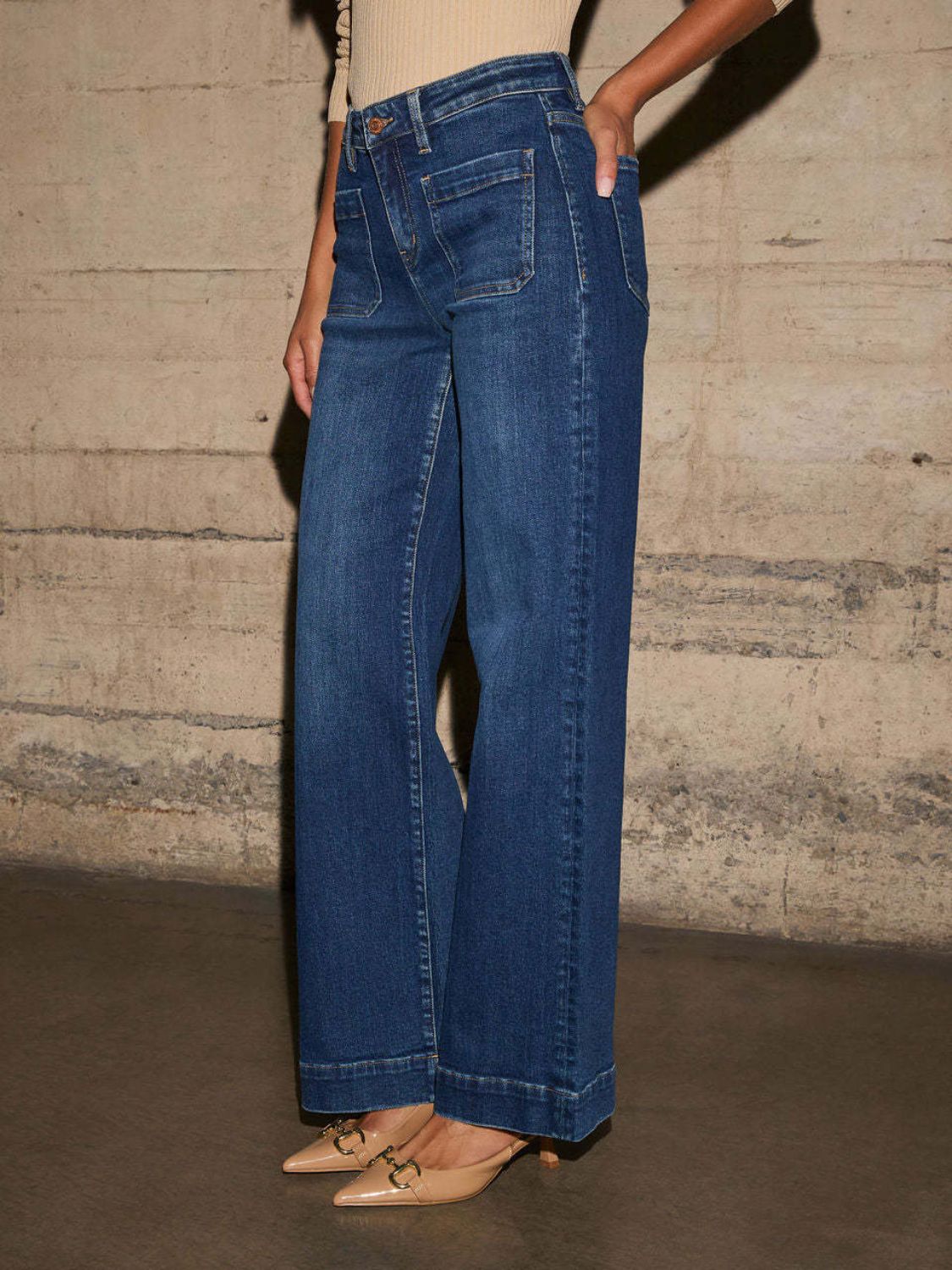 Sailor-inspired wide leg jeans in medium wash denim with utility pockets.