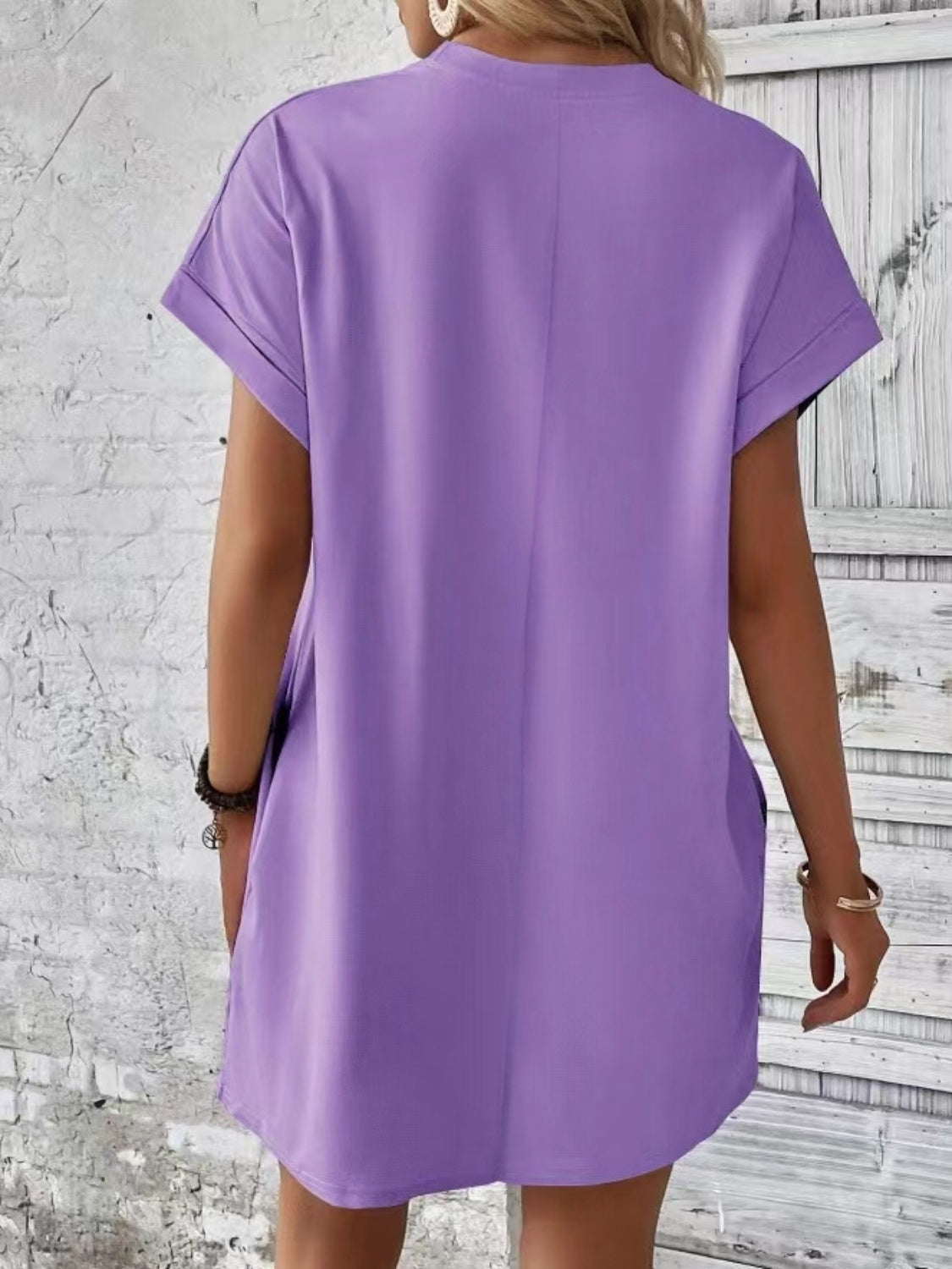 Lavender relaxed tee dress with cuffed sleeves and pockets, casual midi length.
