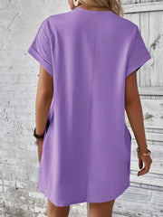 Lavender relaxed tee dress with cuffed sleeves and pockets, casual midi length.
