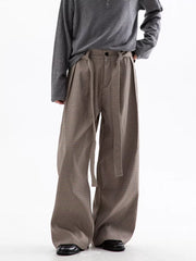 Men's wide leg check trousers in beige and brown with a belted waist.