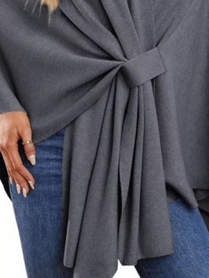 Dark gray knit cape top with tie-front detail and draped elegance