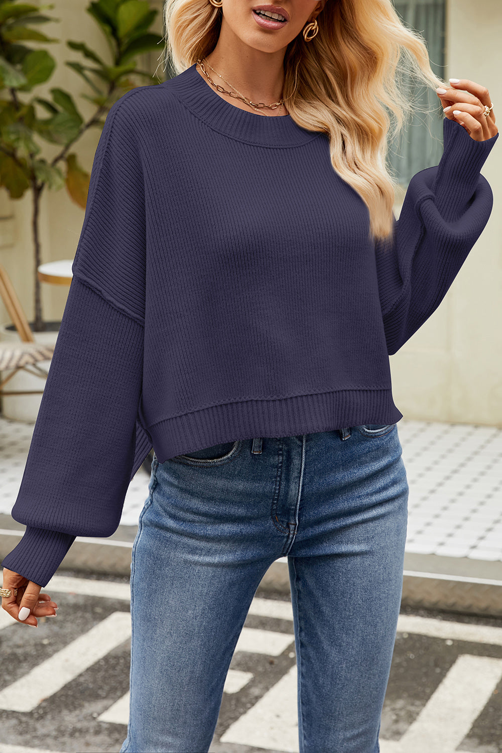 Boxy ribbed knit sweater in dark blue with crewneck and balloon sleeves.