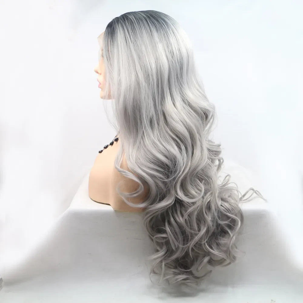 Voluminous lace front wig in black to grey ombre with loose waves.