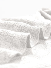 White woven texture cap-sleeve top showing fabric detail