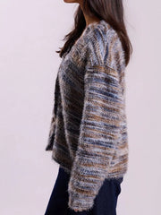 Cozy textured knit cardigan in a multi-color stripe pattern with fuzzy yarn and a relaxed fit.