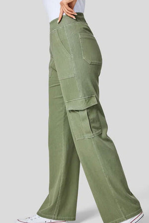 Utility denim wide-leg cargo pants in Matcha Green with multiple pockets.