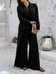 Black split-front palazzo pants and button-down shirt set with adjustable waist.